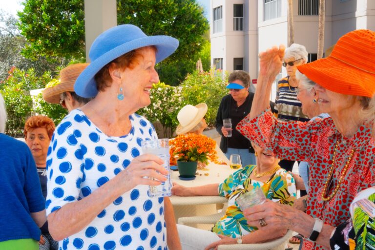 Residents socializing at an outdoor event at The Glenview