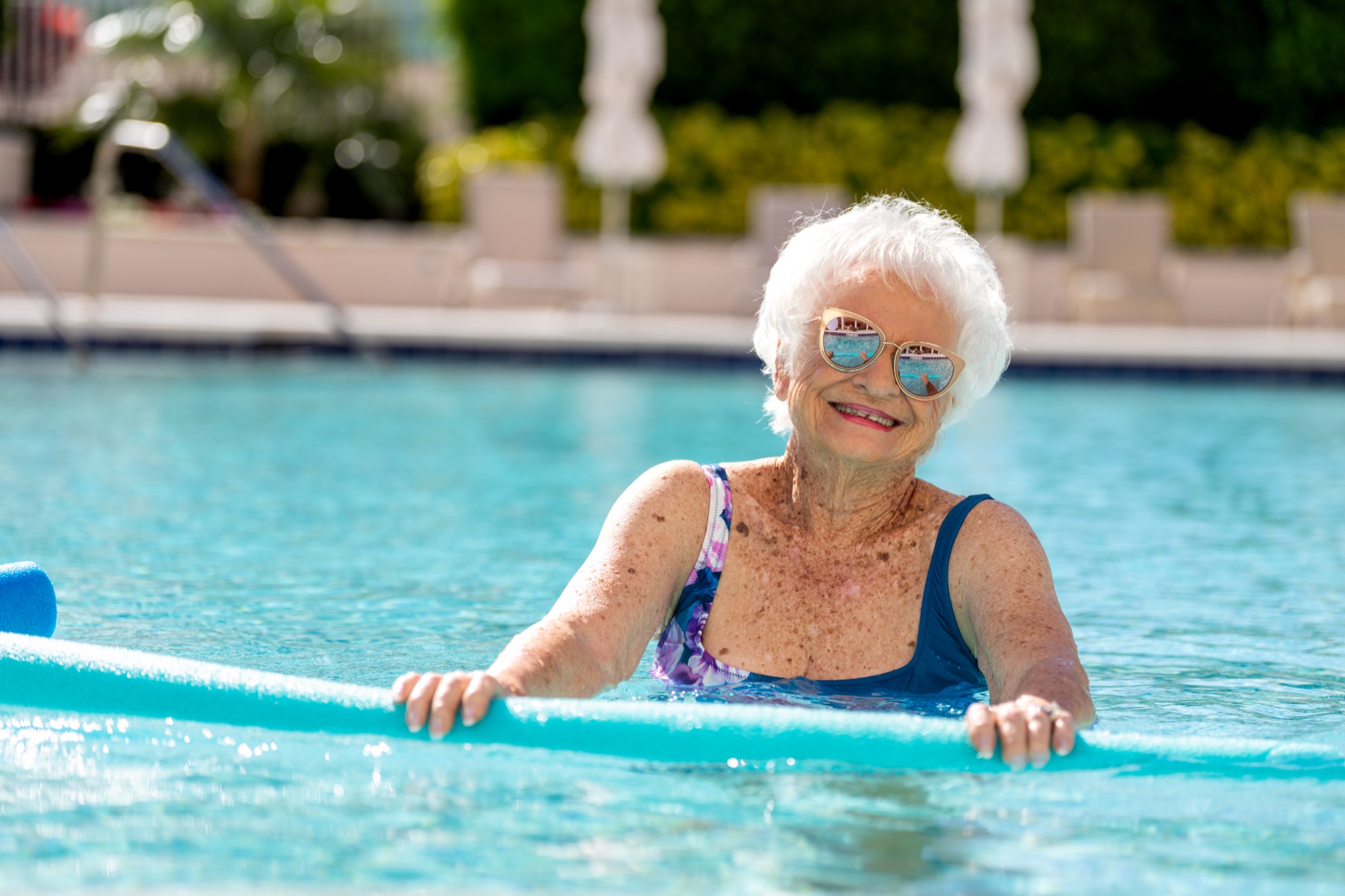 Resident enjoying the pool at The Glenview