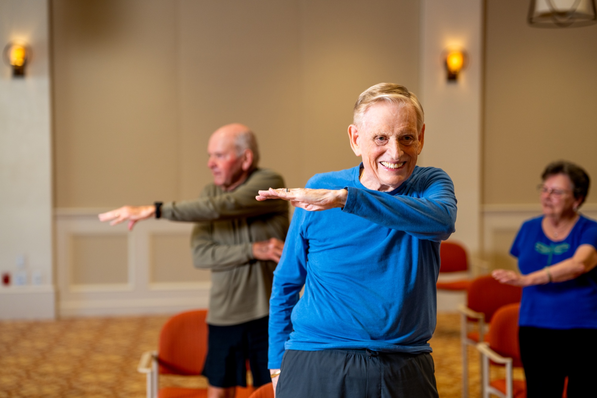 Residents stretching in group fitness class at The Glenview
