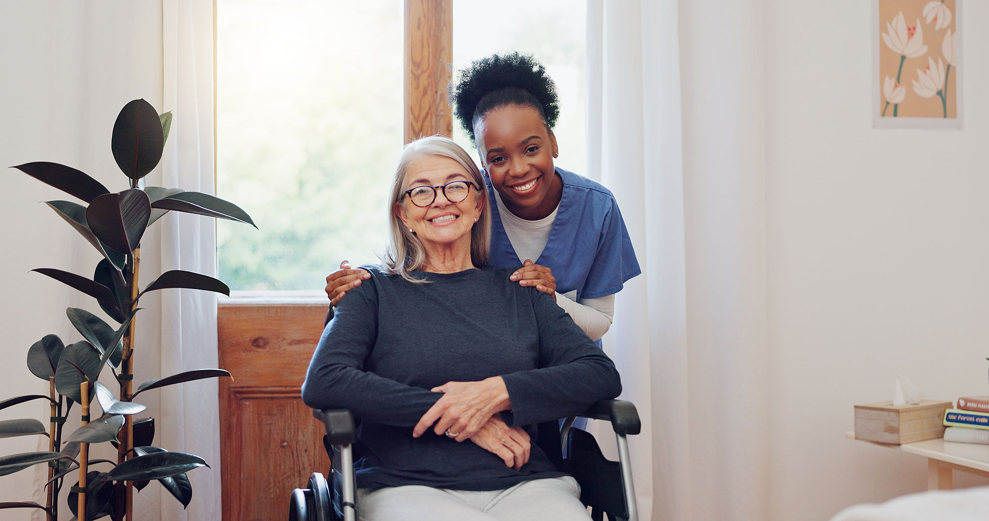 nurse and older woman in a wheelchair